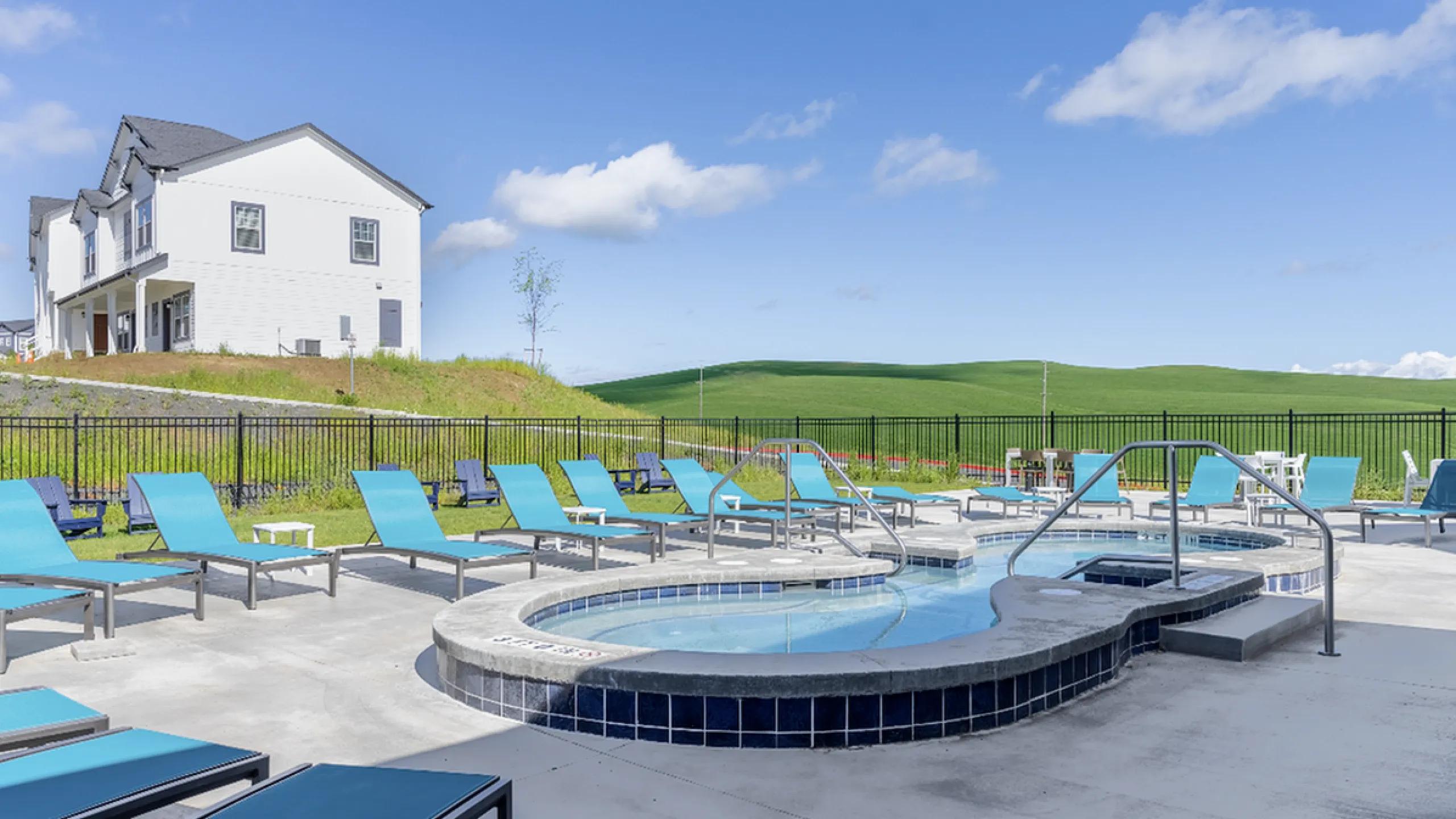 Hot tub with concrete deck surrounding 