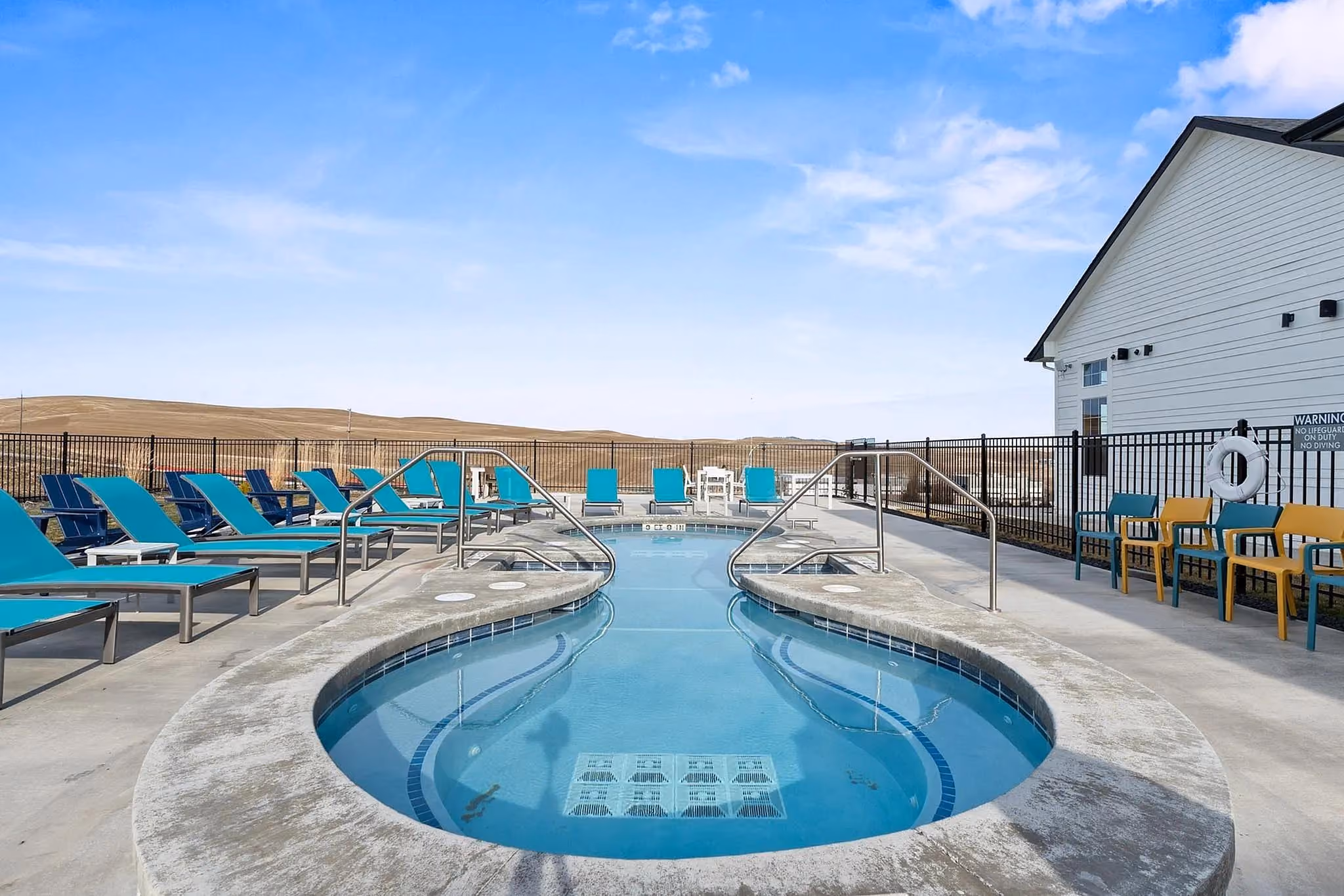 Hot tub with concrete deck surrounding 