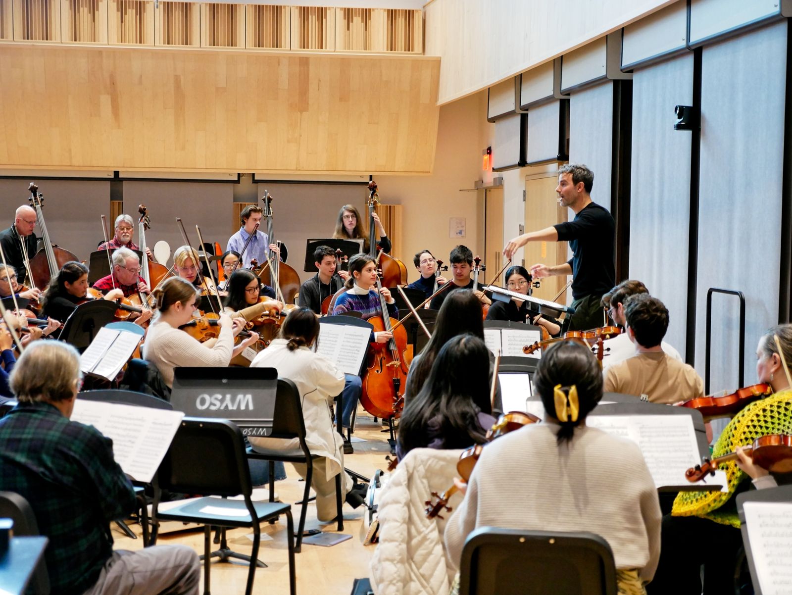 Kyle Knox conducting the adult reading orchestra