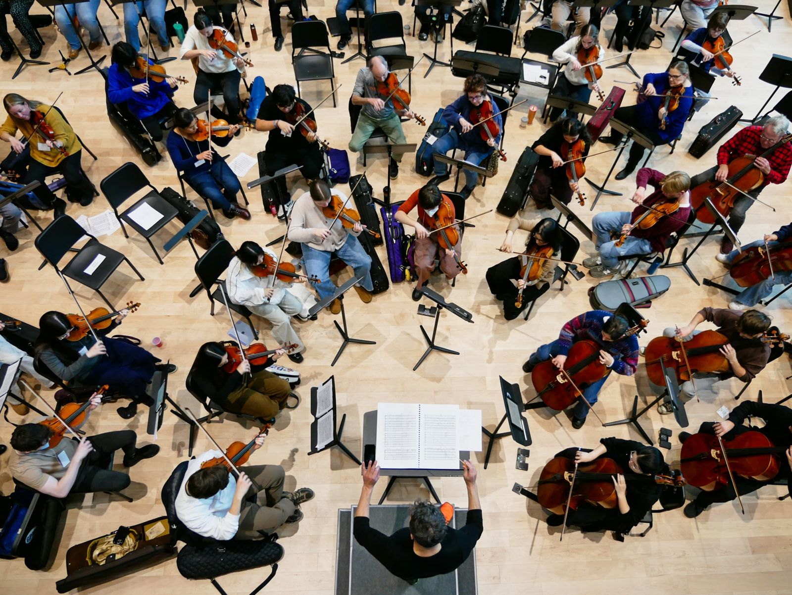 Adult musicians reading an orchestral work in Marvin Rabin Hall