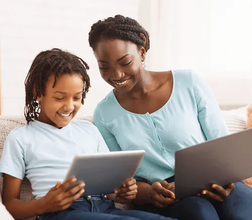 Parent and child exploring gamified financial literacy for youth together.