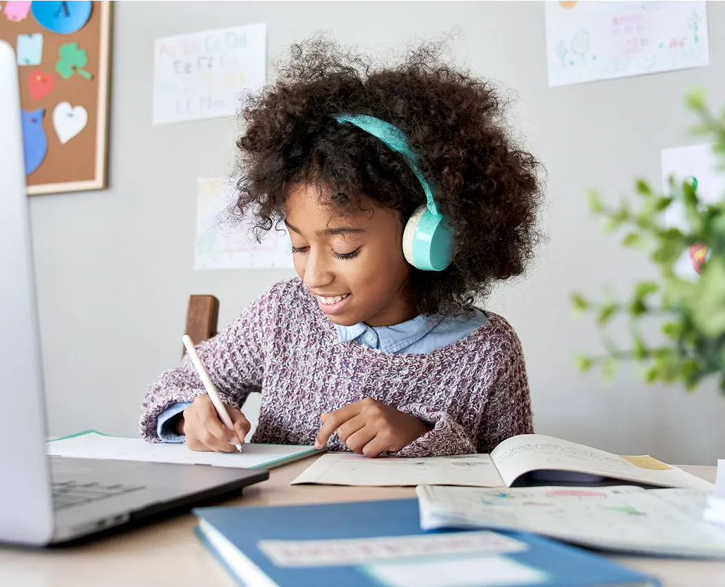 Student completing AI-powered micro-learning for children at home.