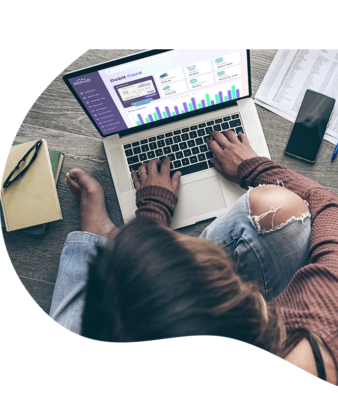 A girl using laptop with Life Hub app on screen