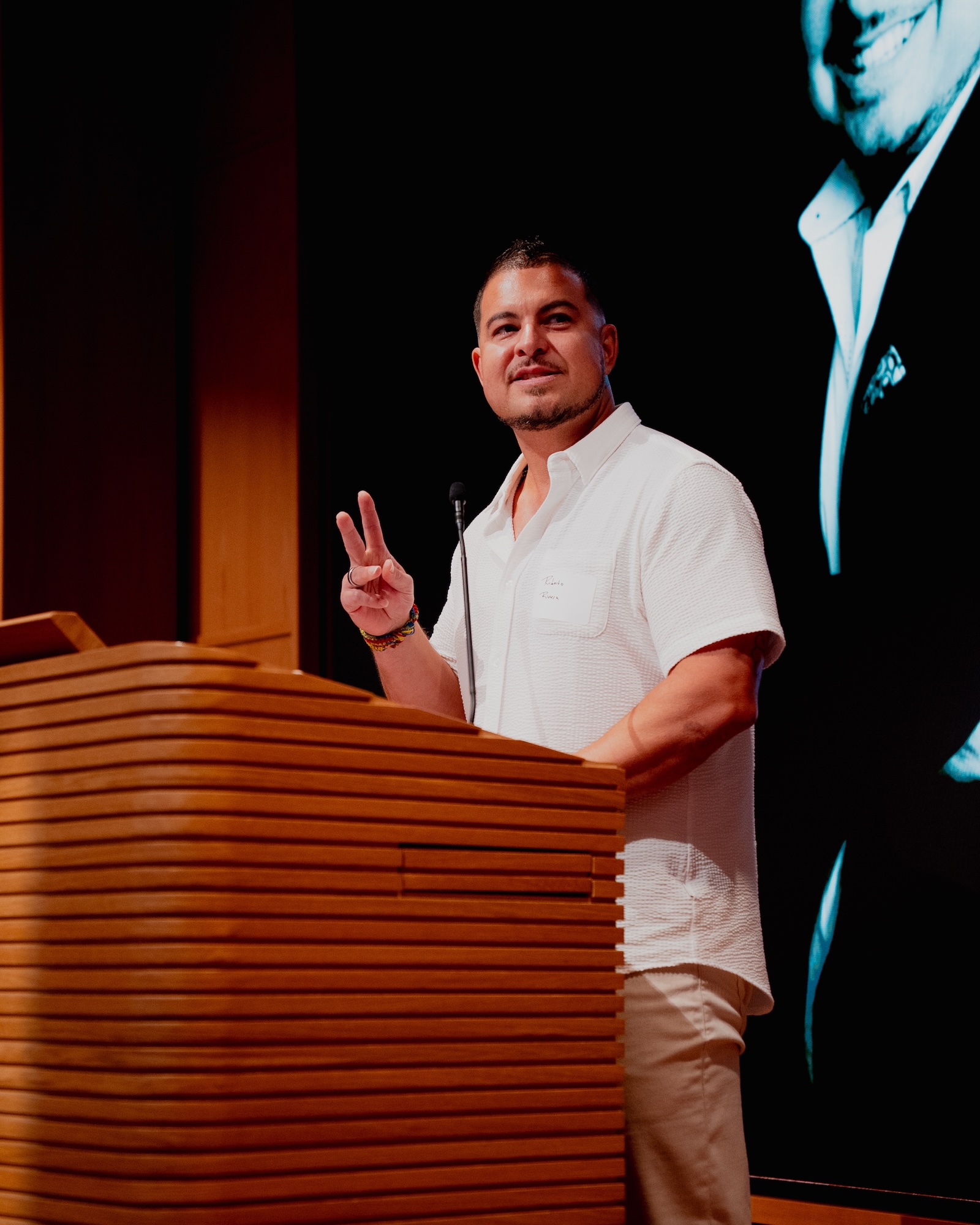 Image of Dr. Rivera at Podium during speaking event at Salesforce Tower.