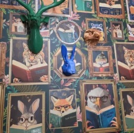 Customer photo of colorful animal heads on a gallery wall