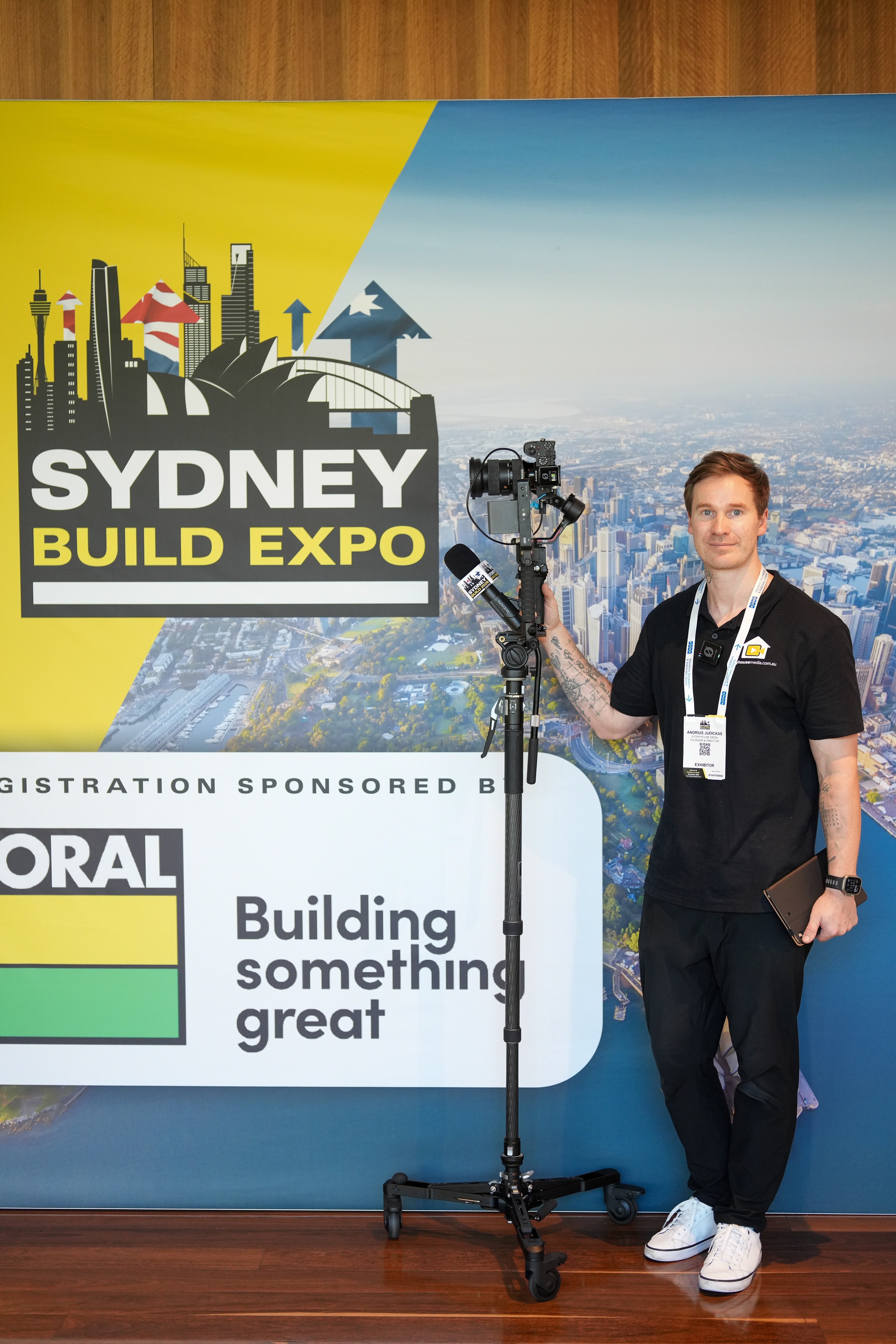 Andrius, Storyhouse Media videographer, with his camera at an event.