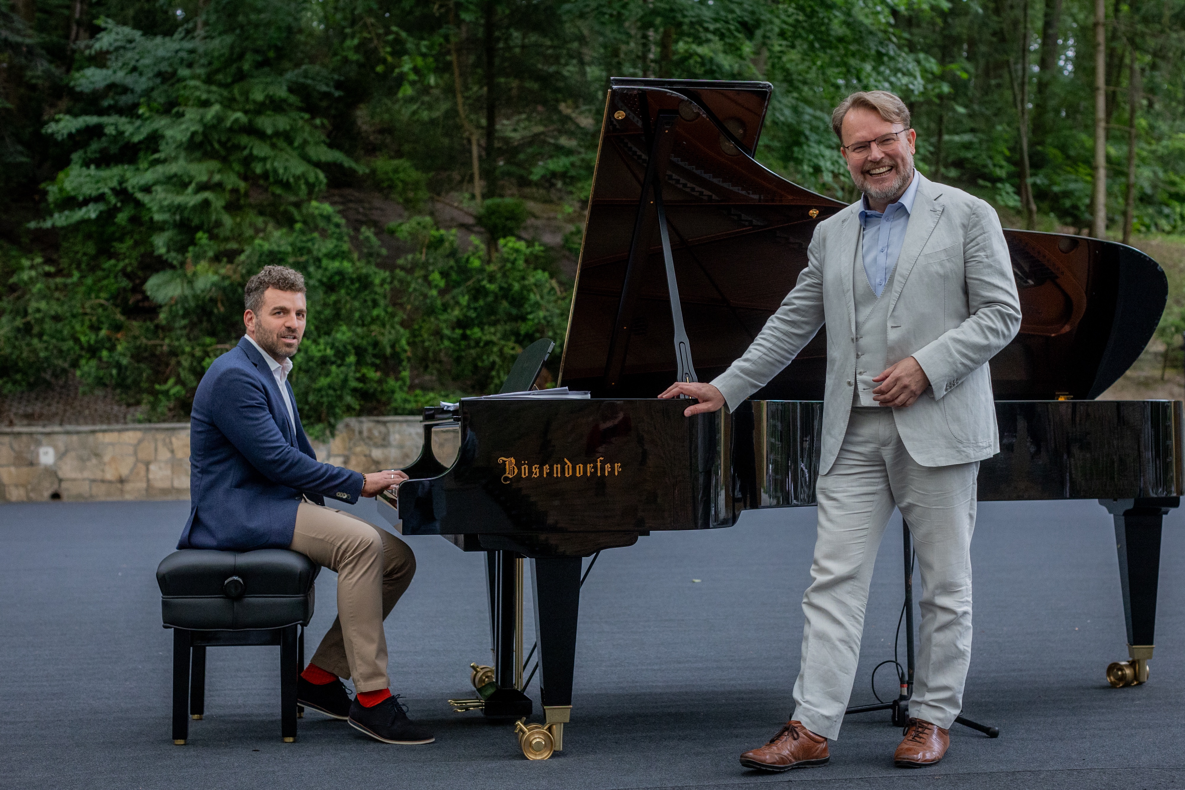 Two men by a grand piano at the Forest Opera in Sopot, Baltic Opera Festival