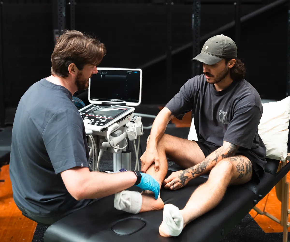 Ultrascan clinician scanning a client's ankle at Empowered Fit gym