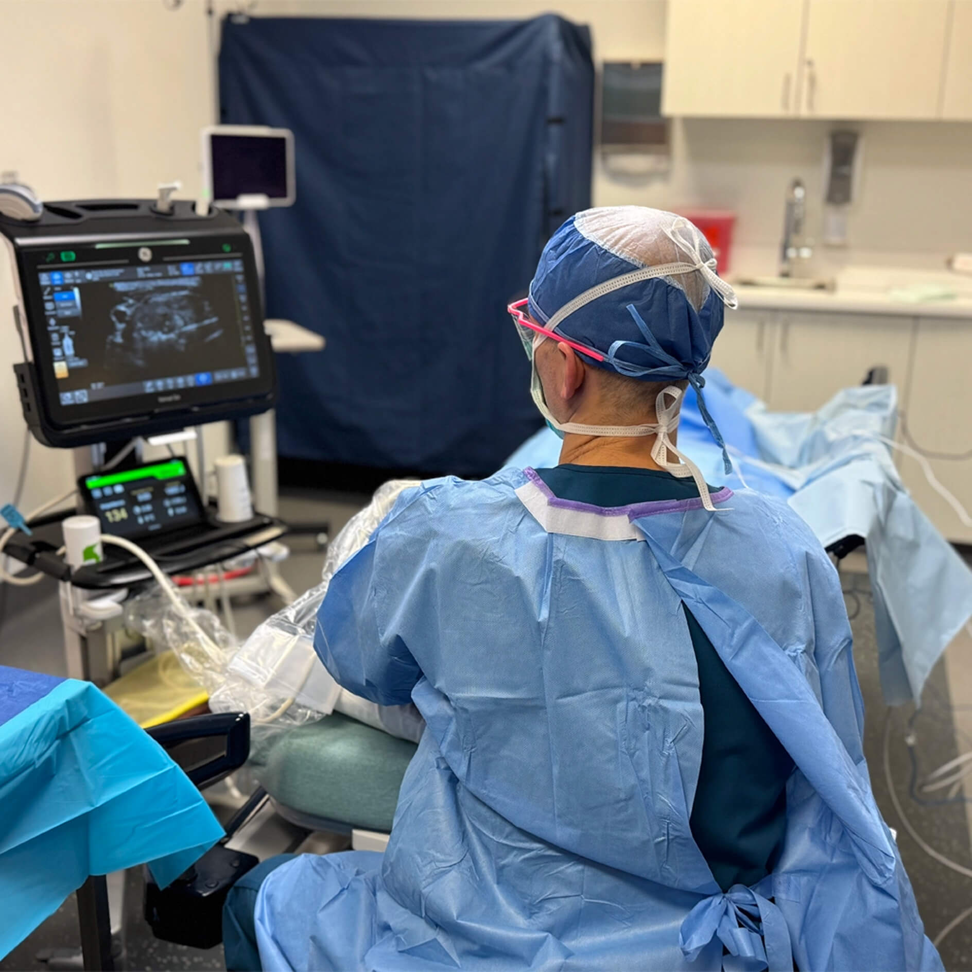 Doctor performing an ultrasound-guided procedure in North Star clinic