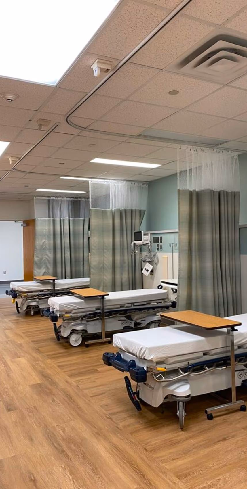 Recovery area with patient beds and privacy curtains