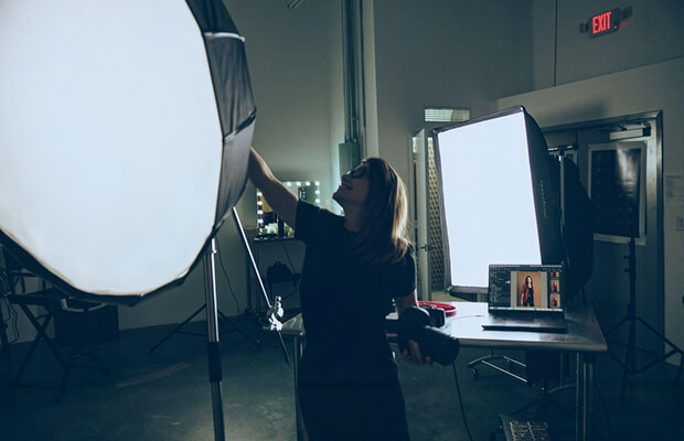 Photographer working with studio lights at Rail 71 Studio