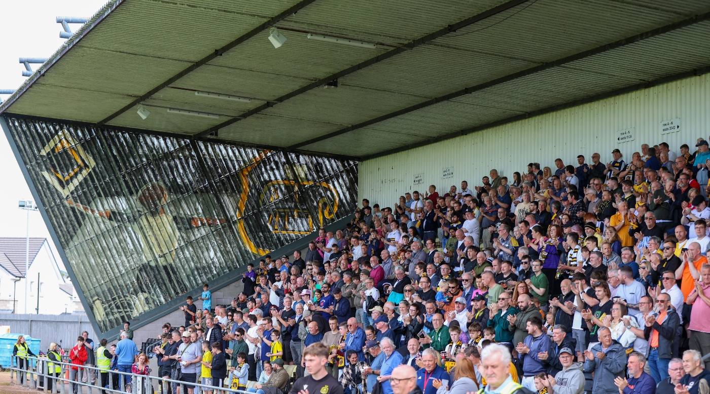 Dumbarton FC supporters in a covered stand on matchday