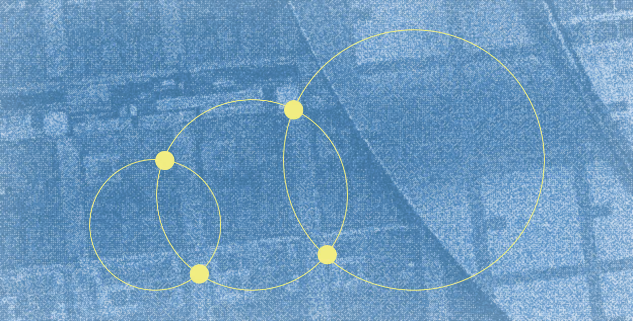 Pattern of four interconnected yellow circles with solid yellow dots at their intersection points on a textured blue background resembling fabric or paper with abstract shapes.