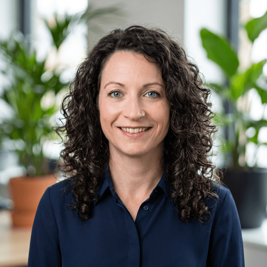 A professional headshot of Julie