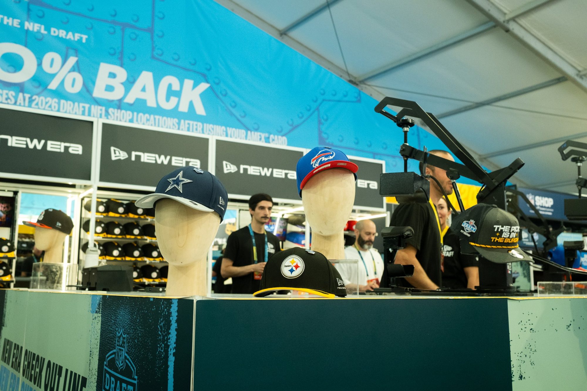 New Era caps on display at the customization bar