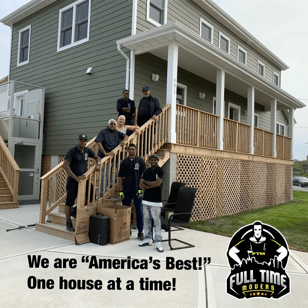 Full Time Movers crew and customers posing on the front steps of a house after a move