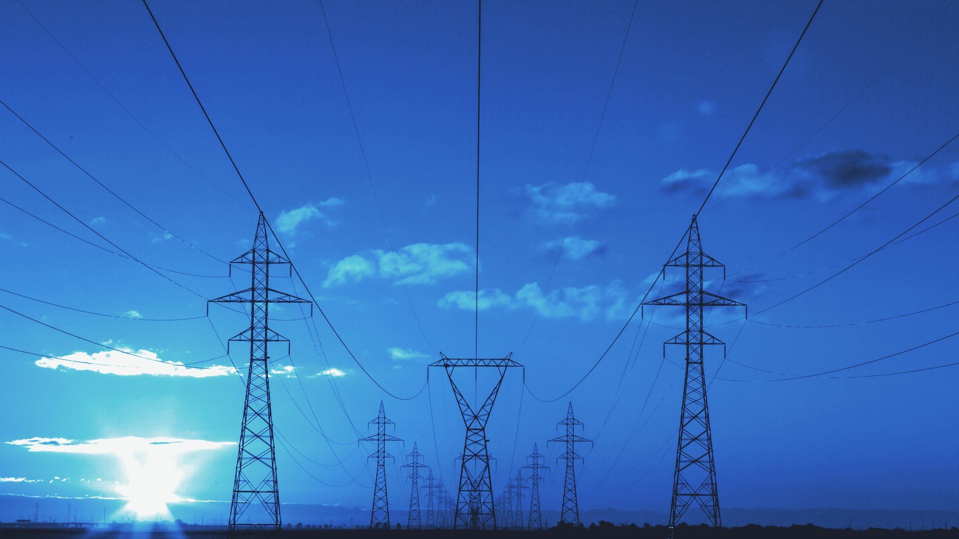 Transmission towers at sunset