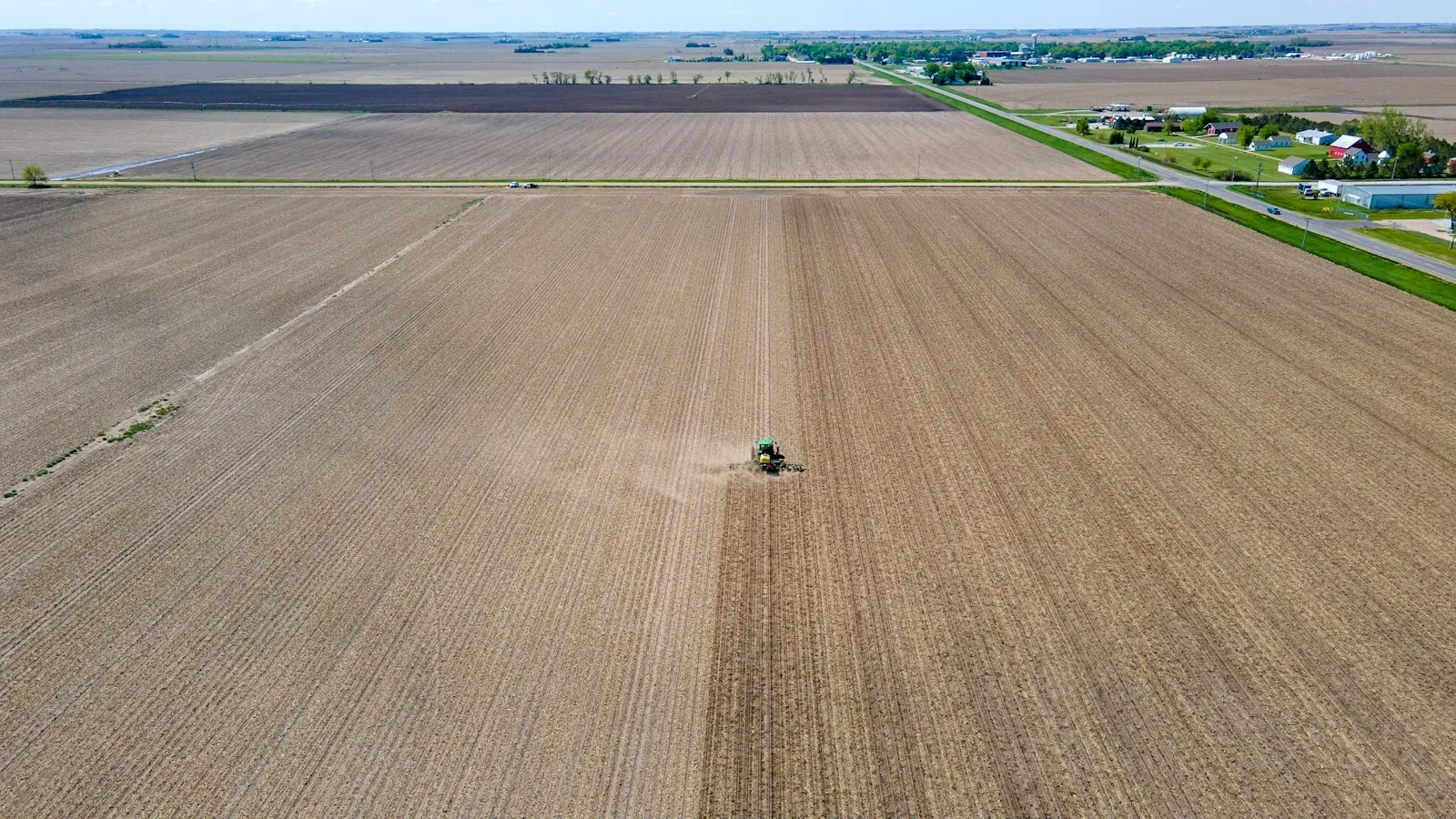 Aerial view of a tractor working a large Nebraska field