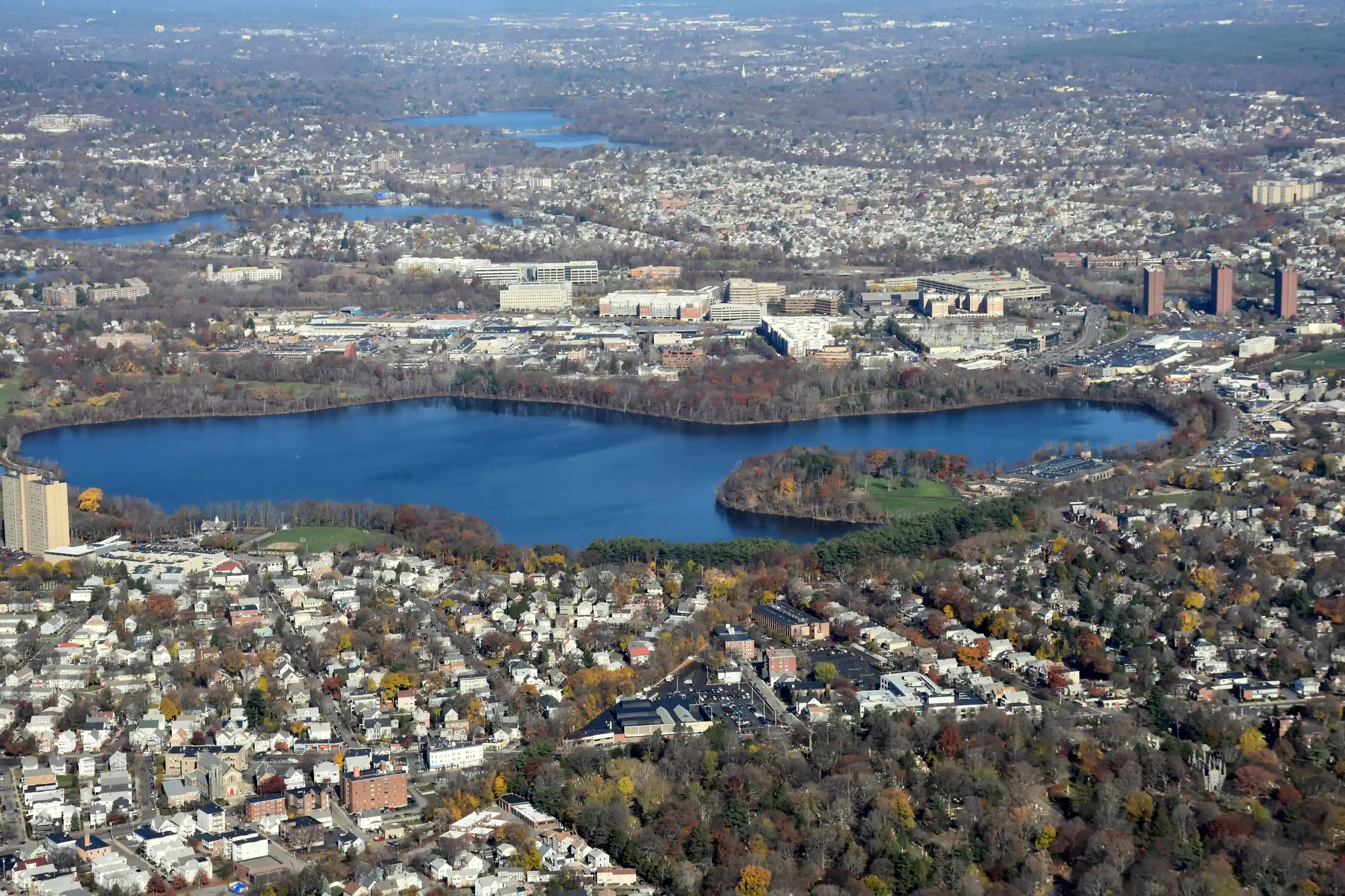 Aerial view of neighborhoods surrounding a lake in Middlesex County.