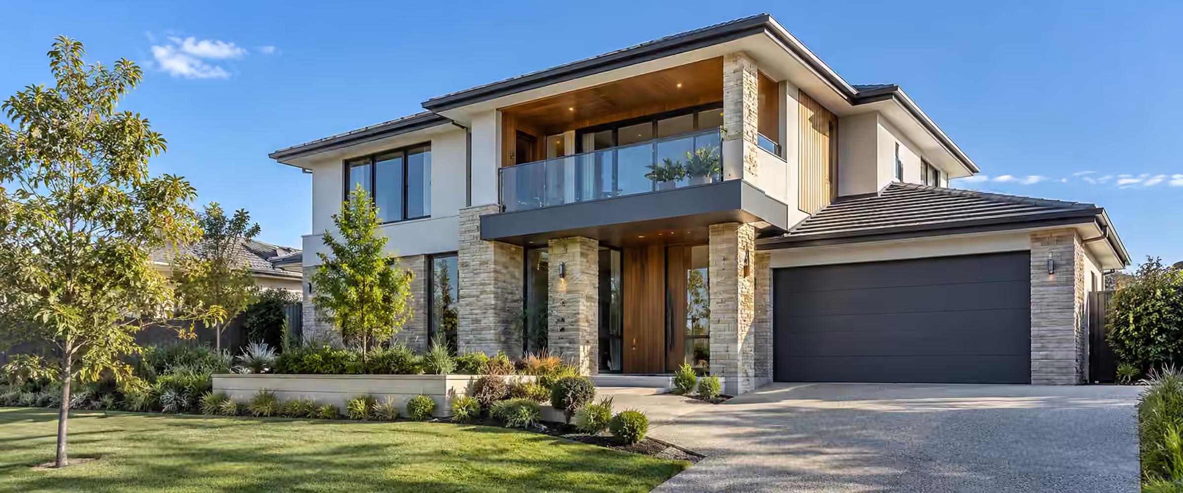 New double storey home with a glass balcony and a double garage