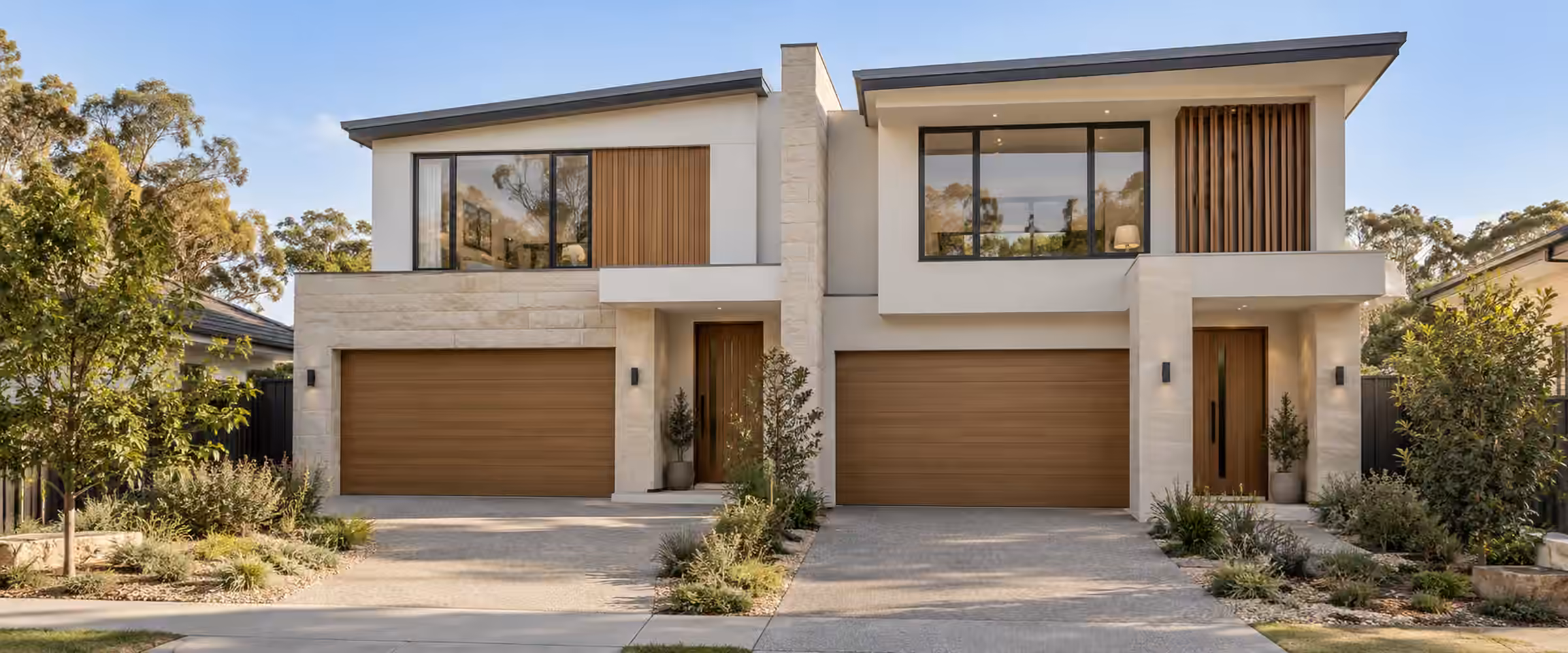 New two-storey duplex with separate entries and garages