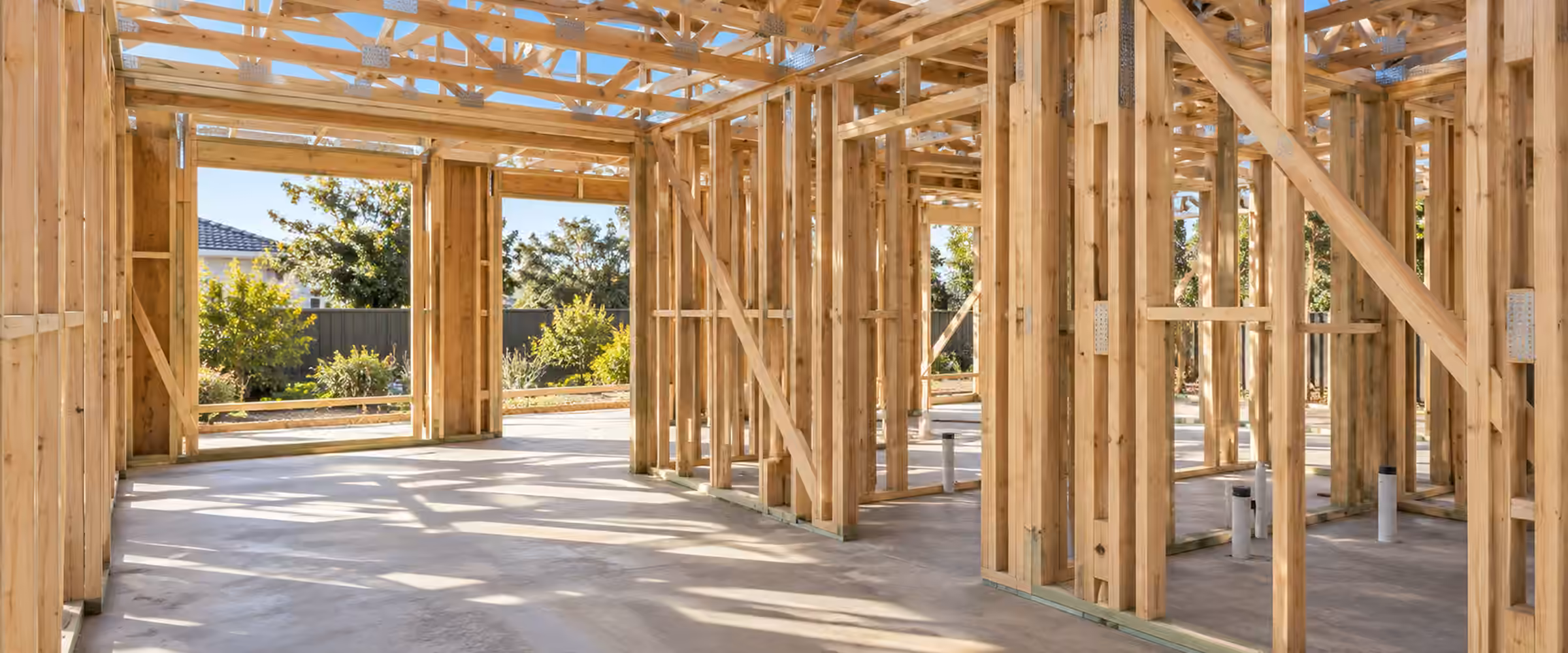 Timber wall and roof framing on a concrete slab, ready for a frame inspection