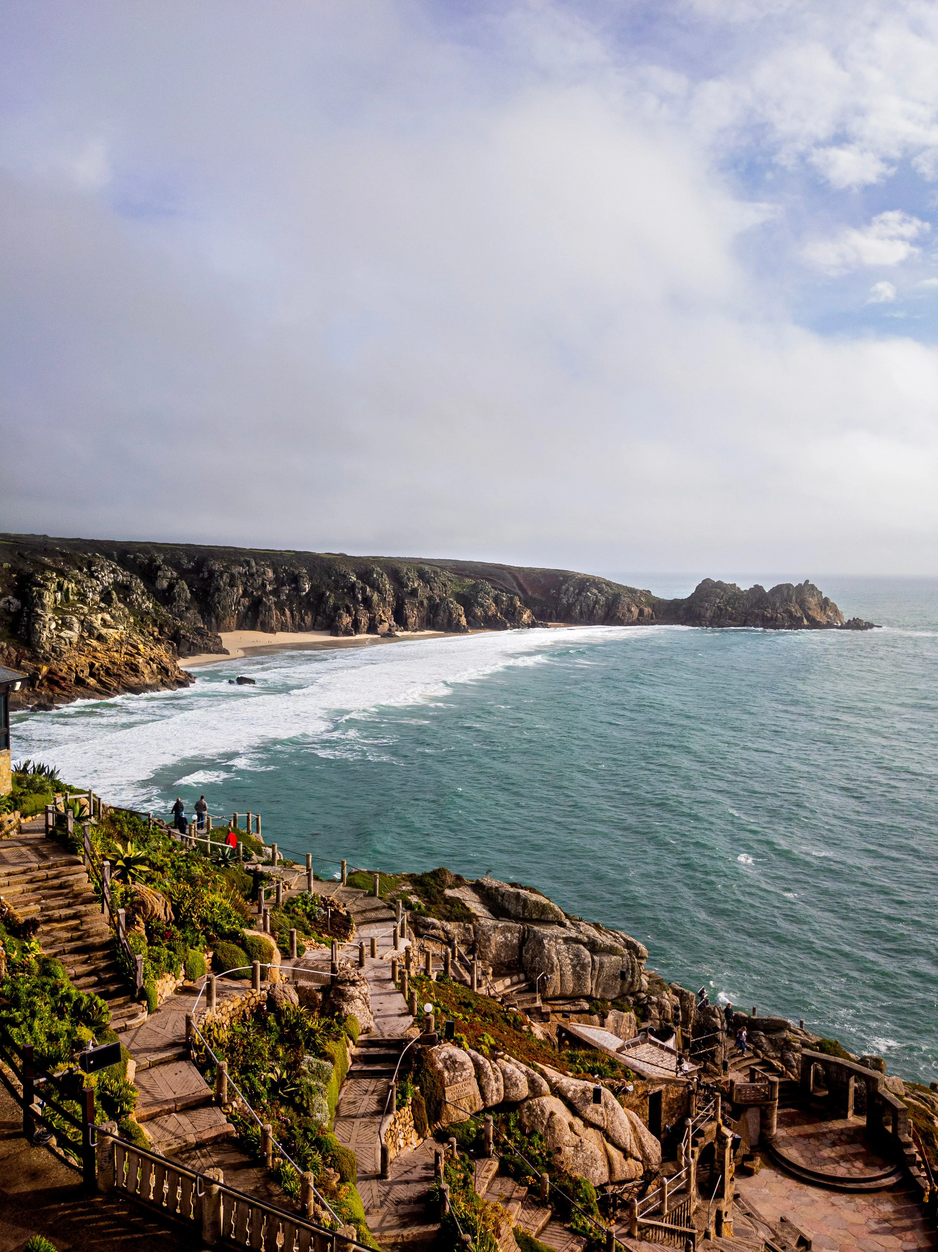Minack Theatre terraces above a Cornish beach and turquoise sea