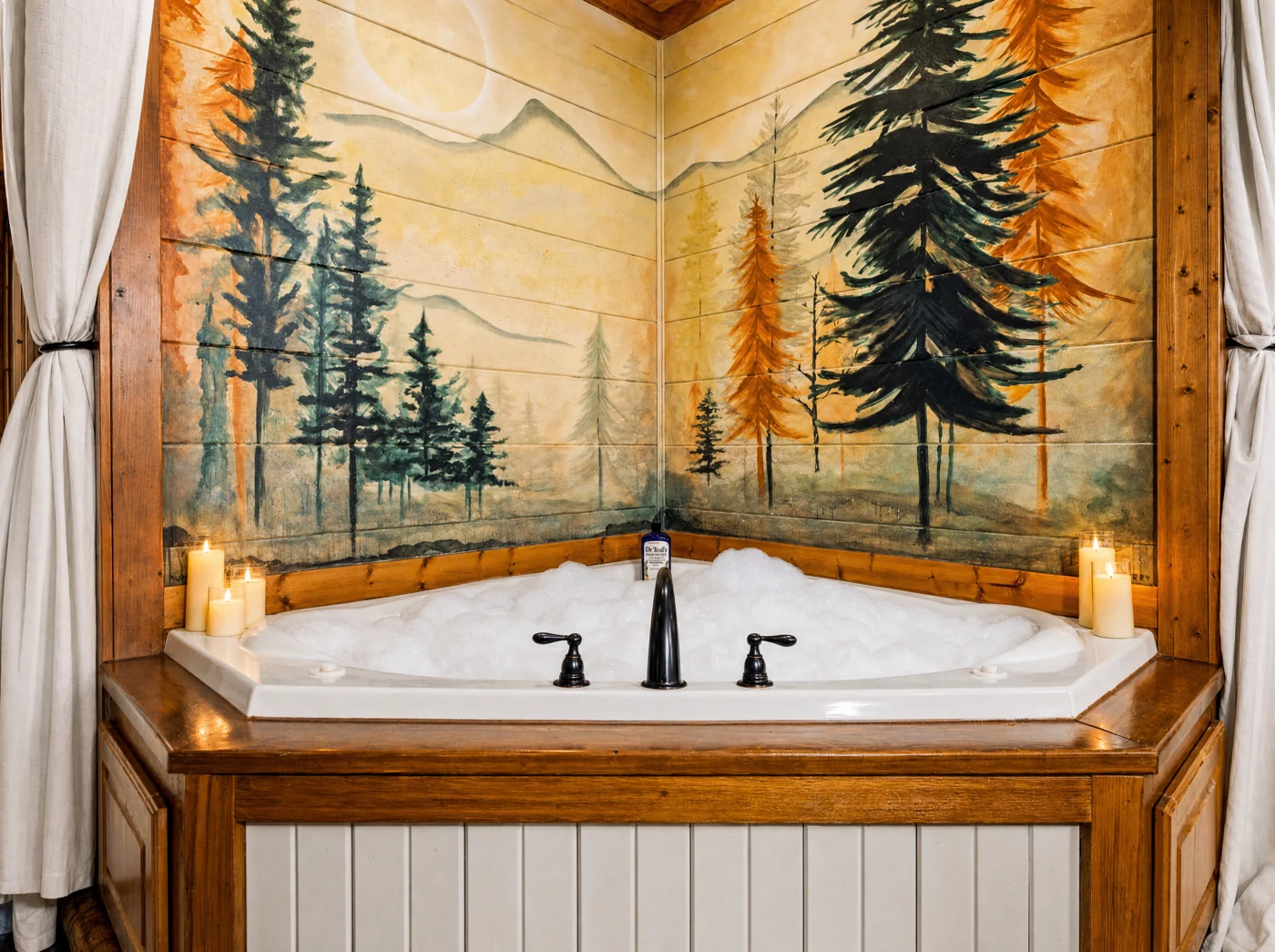 The indoor soaking tub beneath the forest mural at Hearth and Heritage