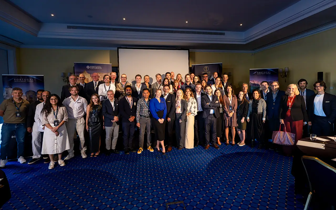 Delegates and speakers gather for a group photograph at day’s end