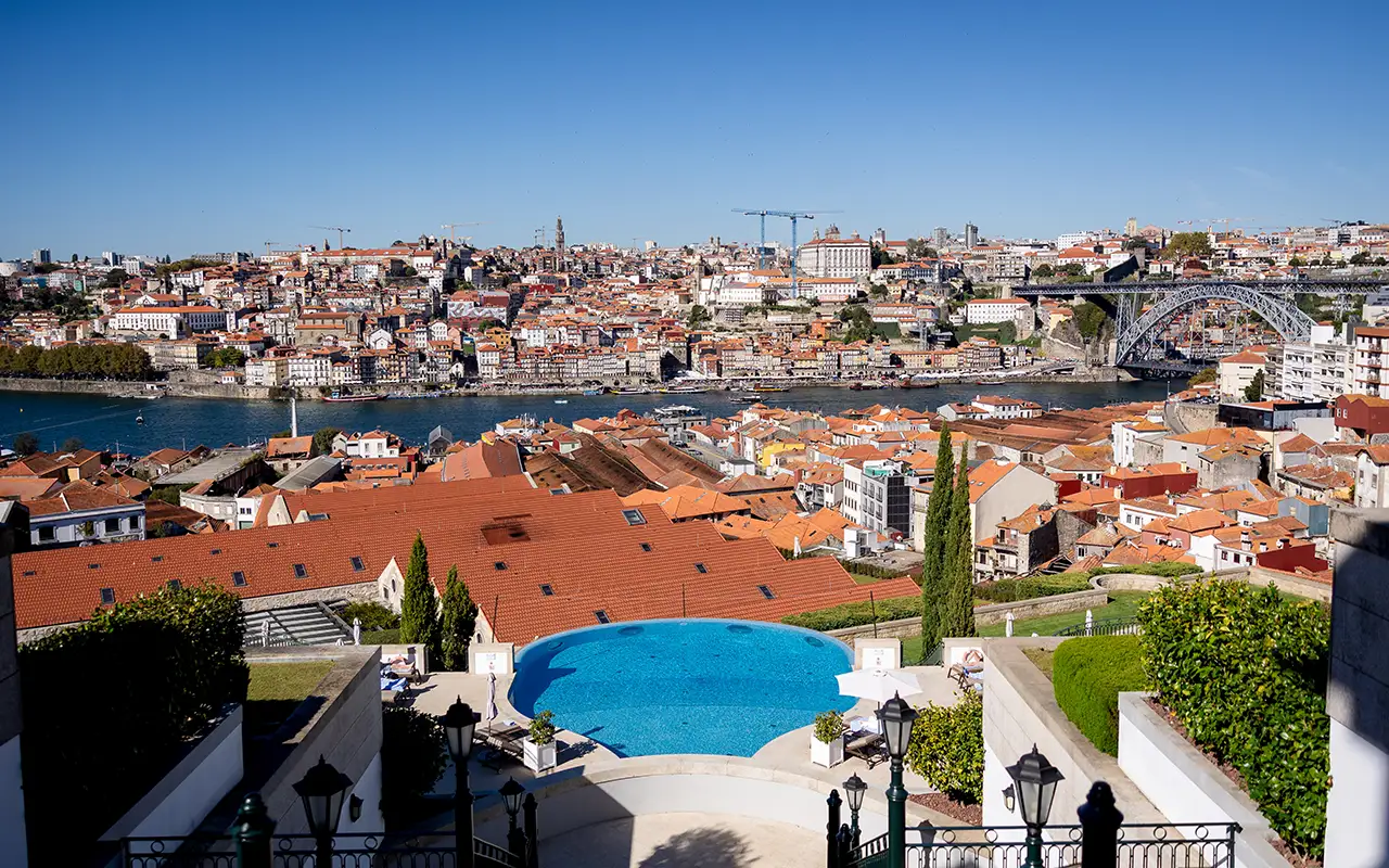 A rooftop pool overlooks the Douro river and Porto’s terracotta rooftops