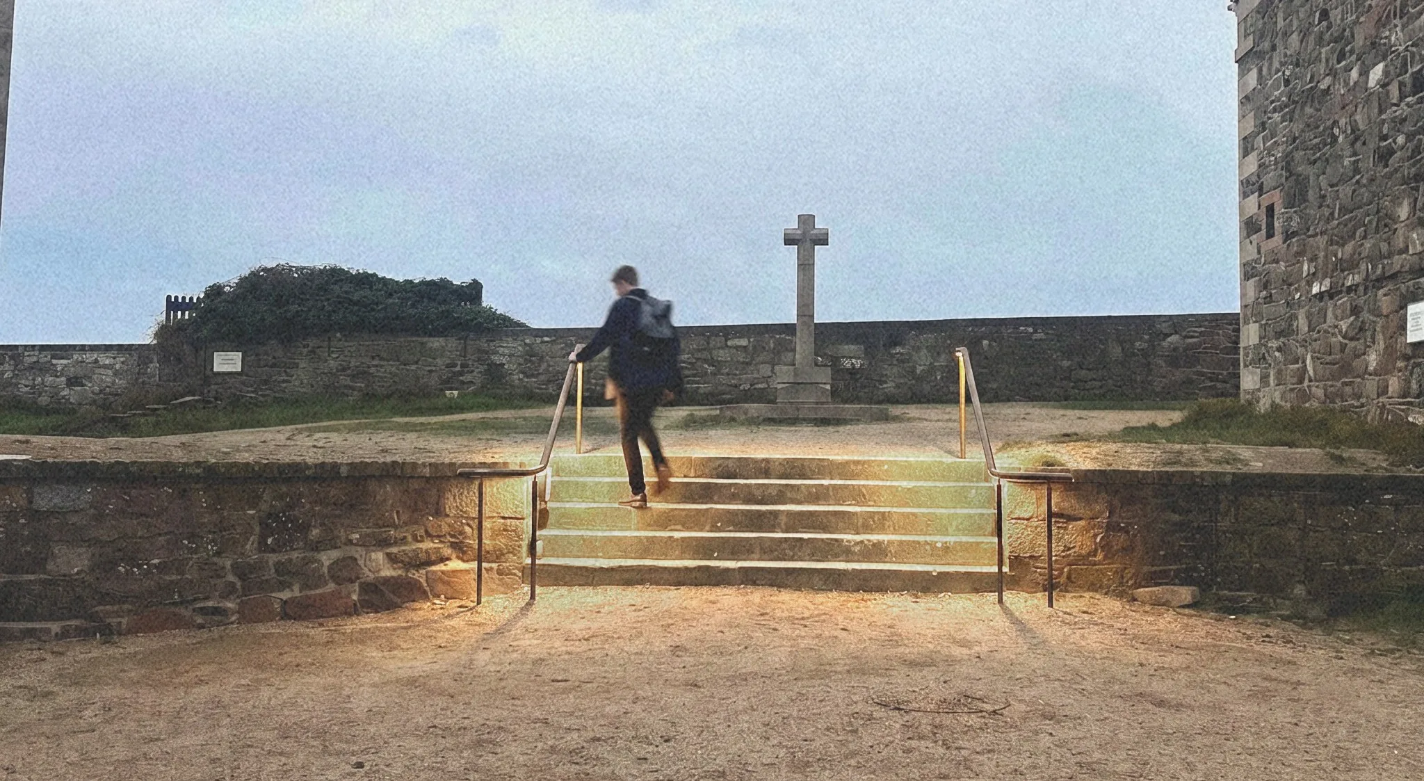 The monument steps at Elizabeth Castle with new bronze handrails and low-level lighting at dusk, St Helier, Jersey