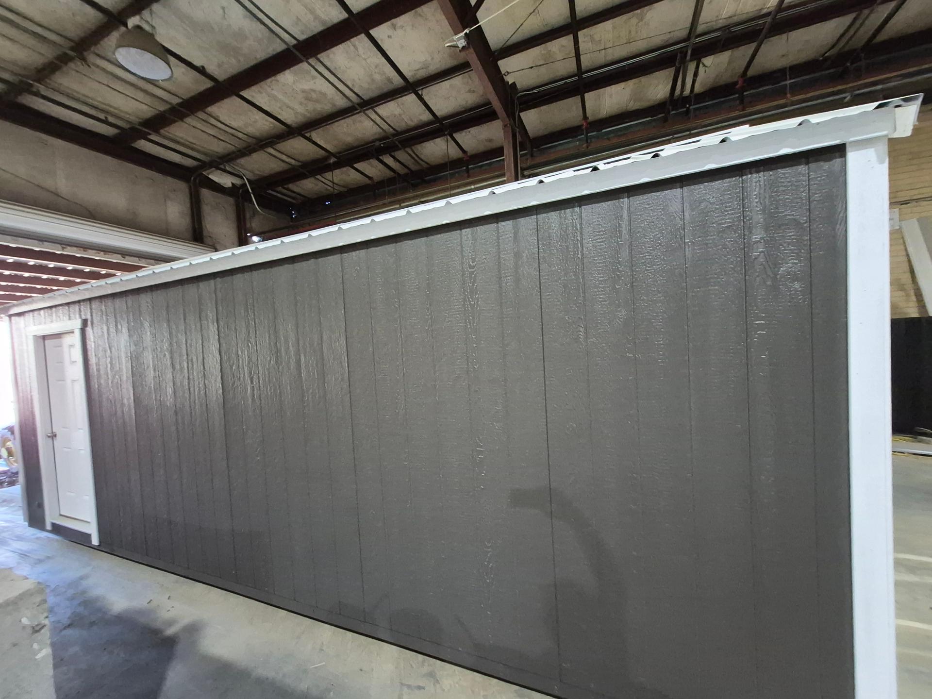 Standard Utility 10x24 portable building in Dark Woods