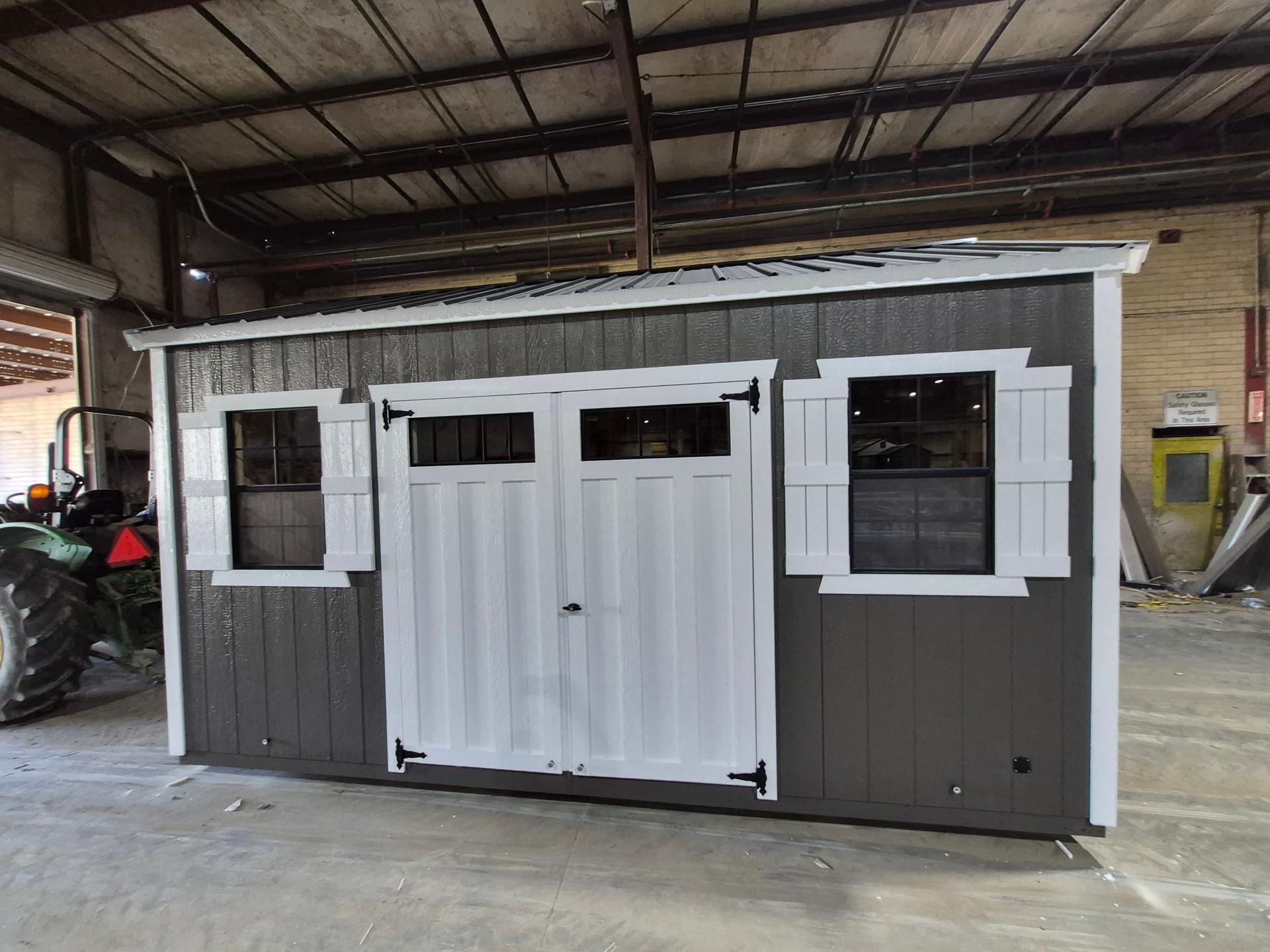 Standard Utility 8x16 portable building in Dark Woods
