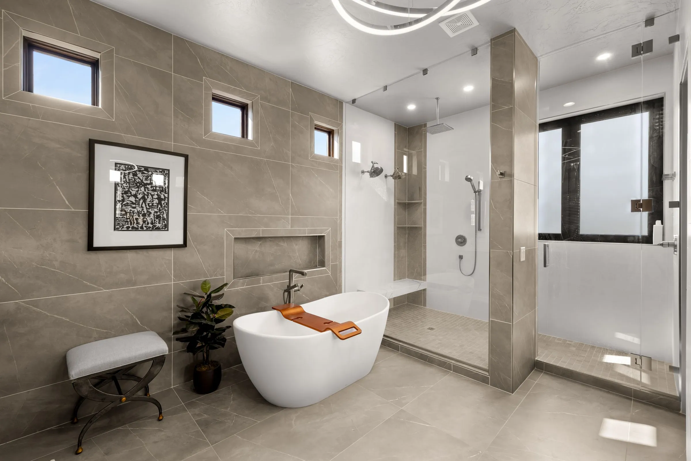Primary bathroom with a freestanding tub and walk in shower