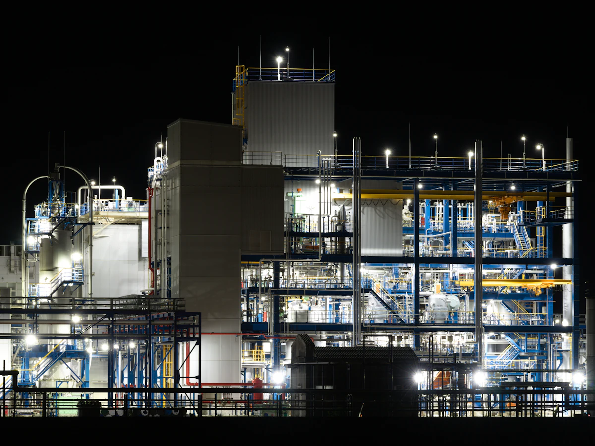 Chemical processing plant illuminated at night