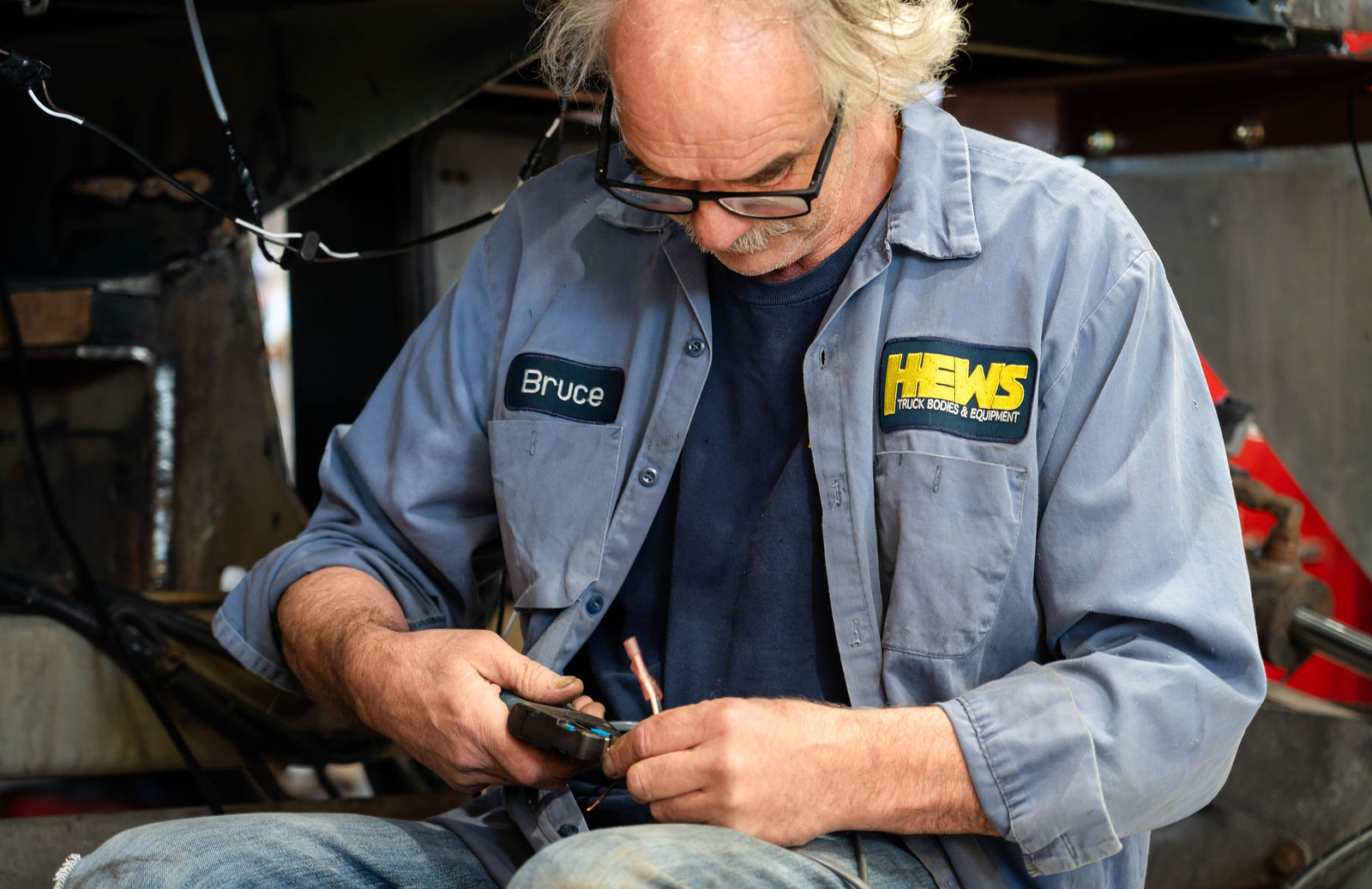 Bruce wiring a component at the Hews shop