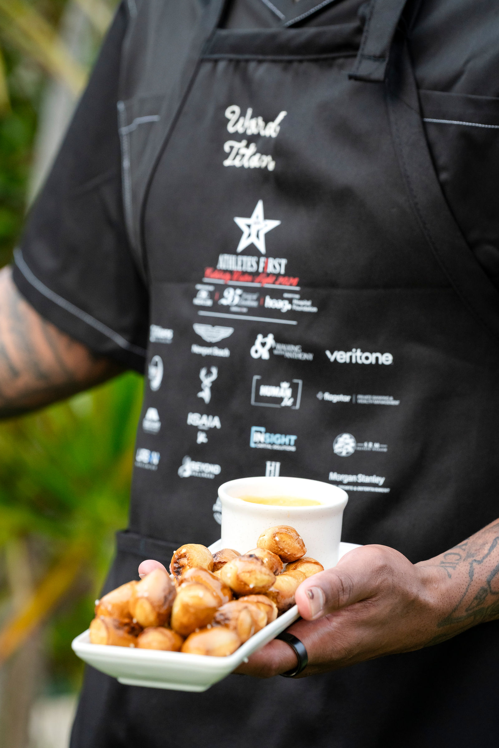 Passed appetizers in front of a branded apron