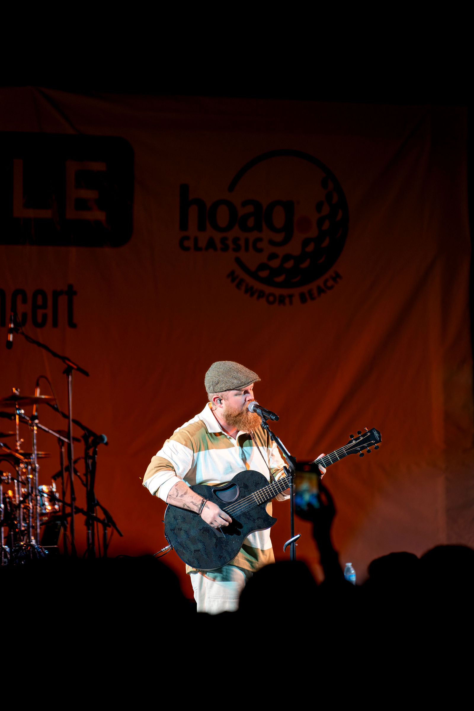 A musician performing on stage during the evening concert