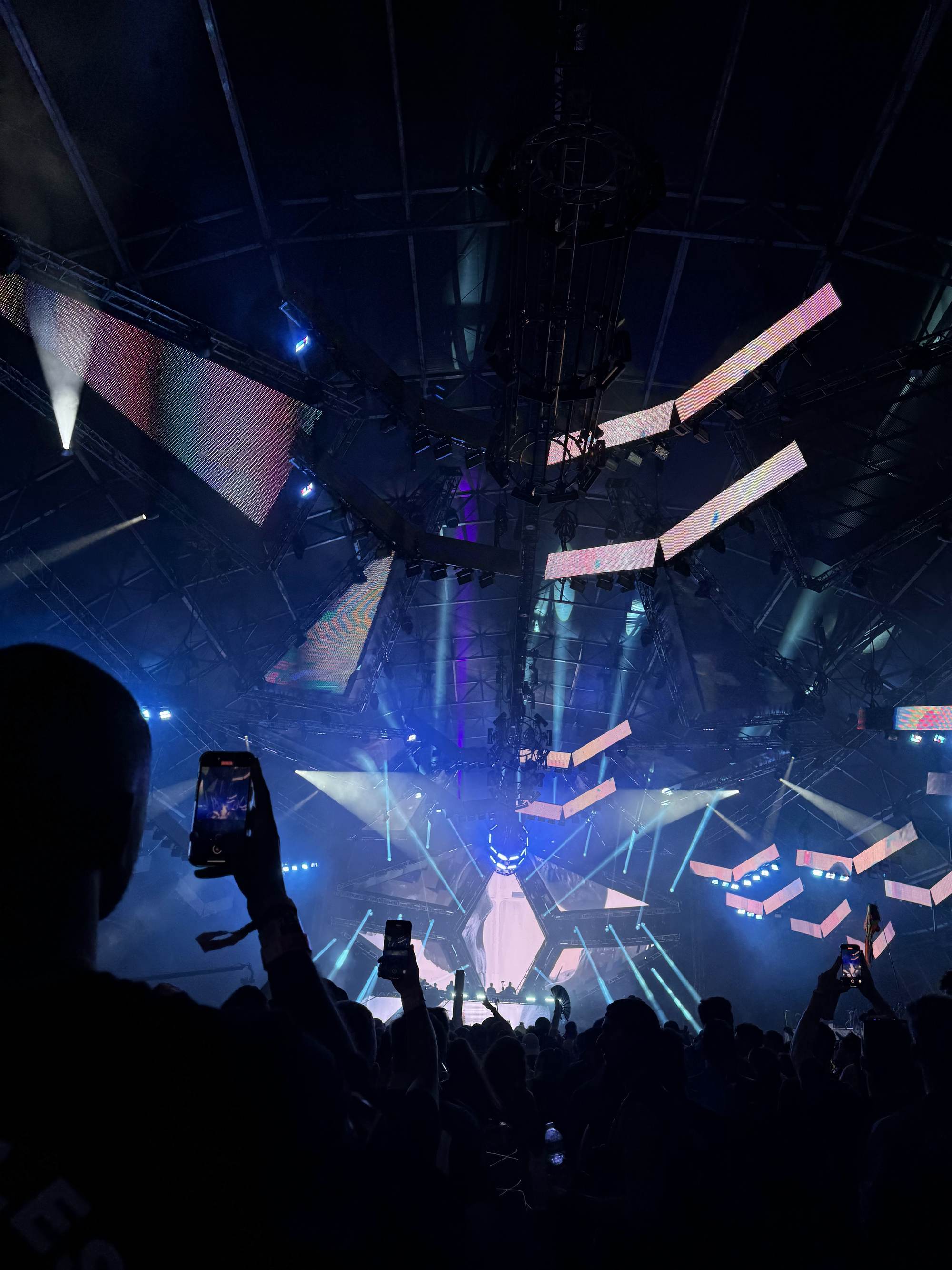 Inside the Ultra Music Festival Miami Resistance Megastructure techno stage, with silhouetted crowd under lights and lasers