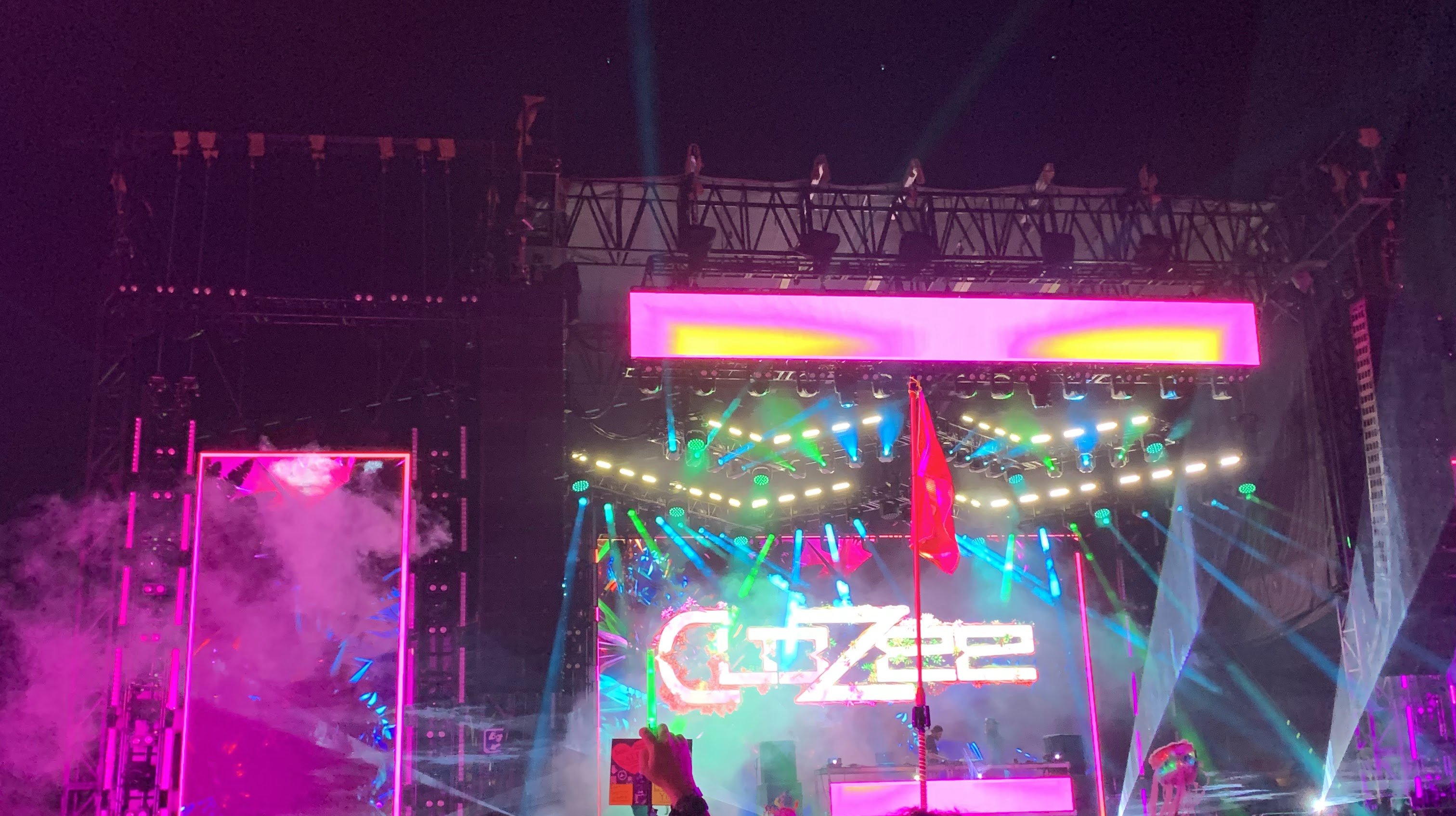 Night stage with lasers and haze at Bonnaroo