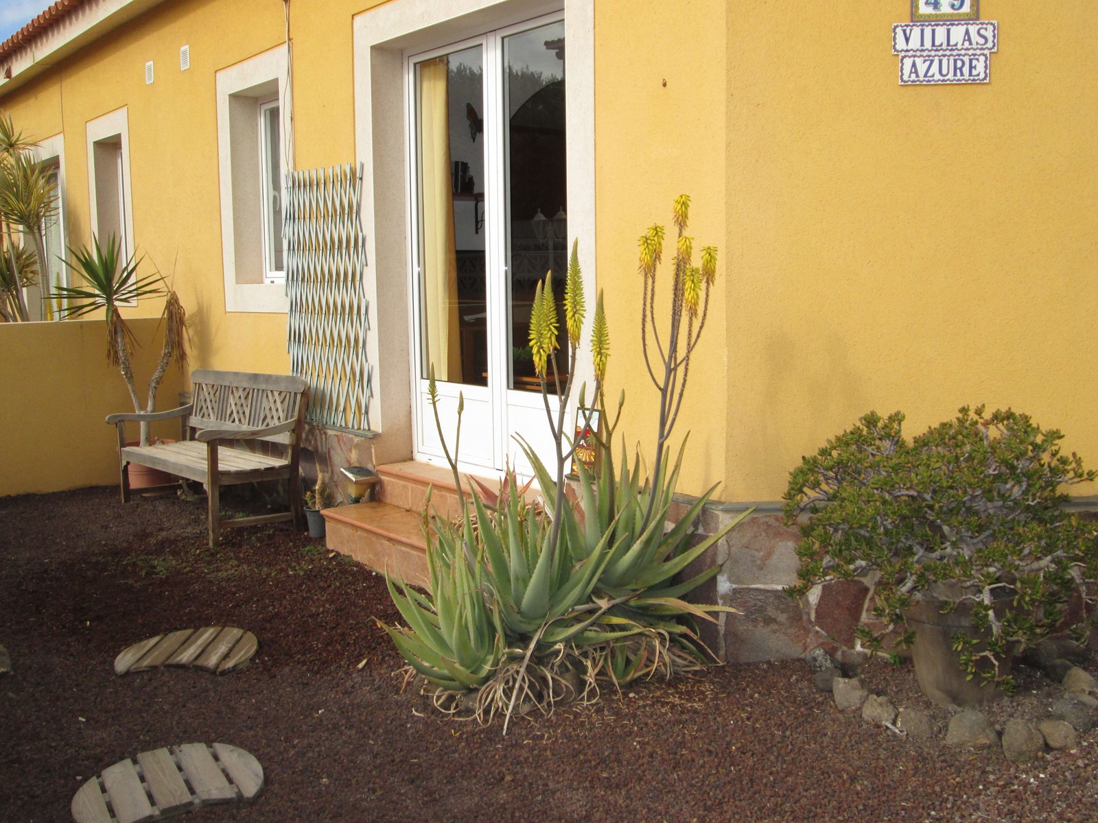 Front garden of the villa with the Villas Azure sign