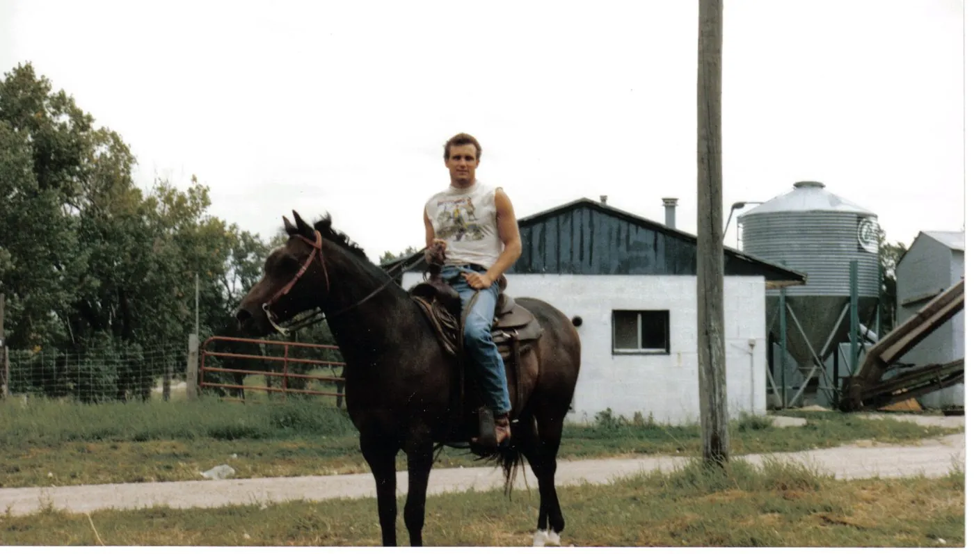 Robert Rapp as a young man on his horse Shadowfax in a Nebraska farmyard