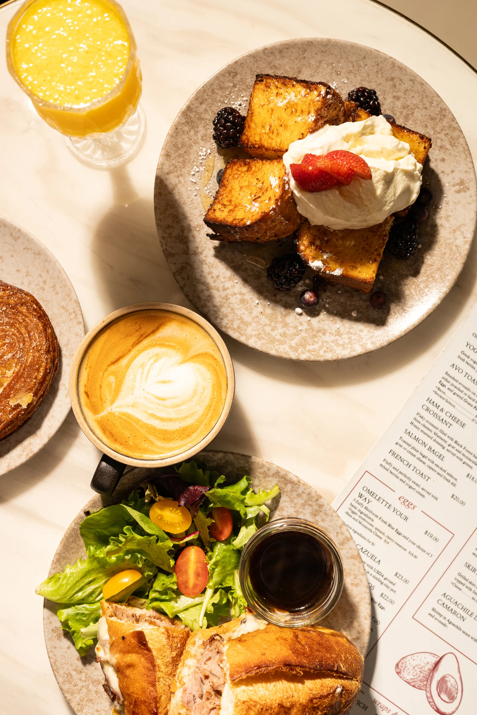 French toast with berries and cream, coffee and orange juice at Amand.