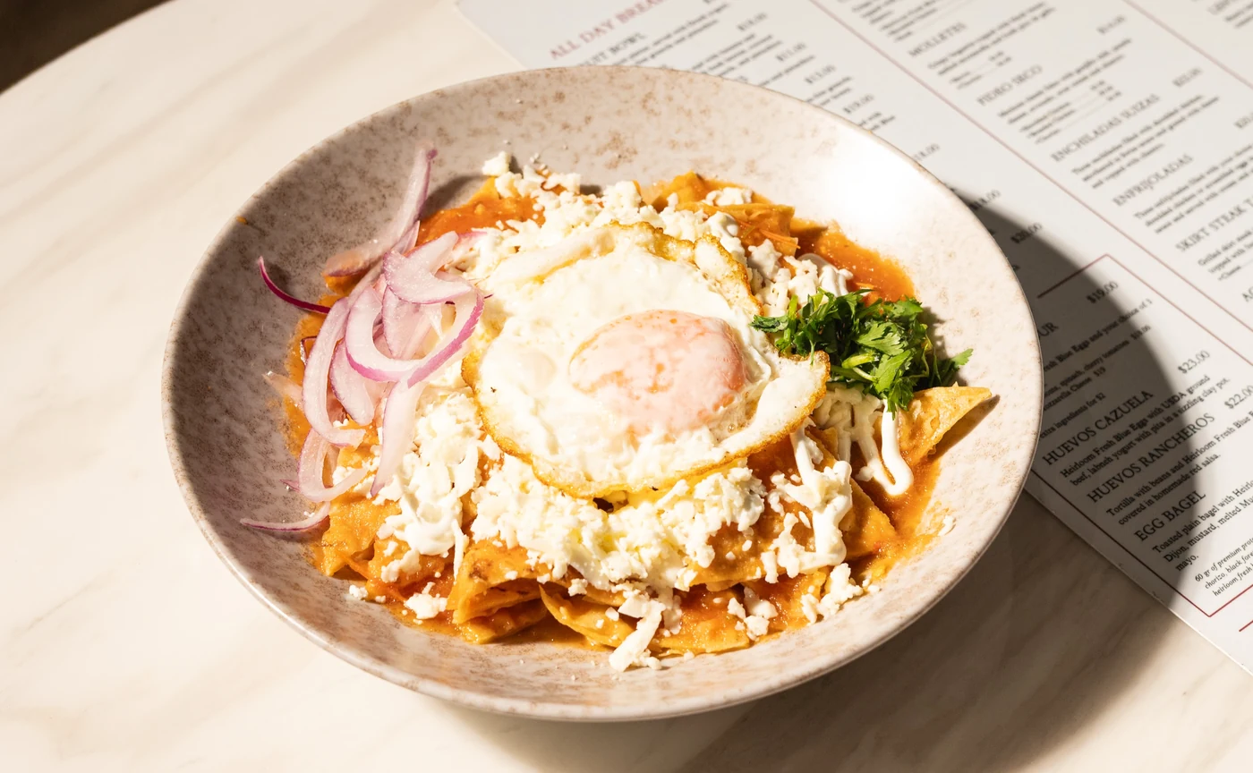 Chilaquiles topped with a fried egg at Amand Café & Bistro