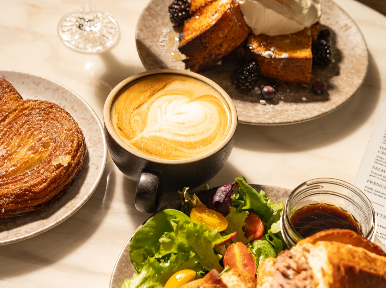 Coffee, French toast and a croissant sandwich at Amand.