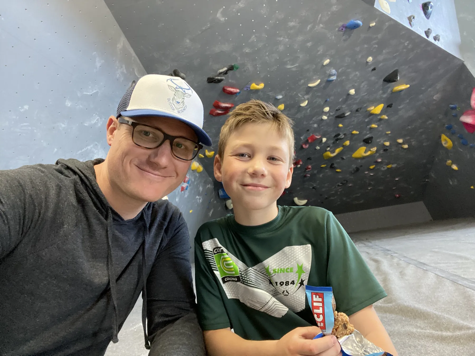 Dr. Haber with son at an indoor climbing gym