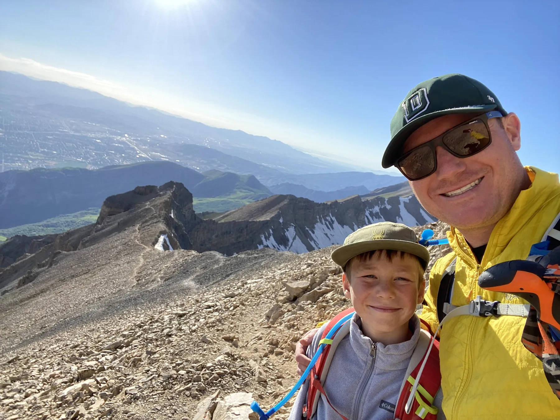 Dr. Haber and child at a mountain summit