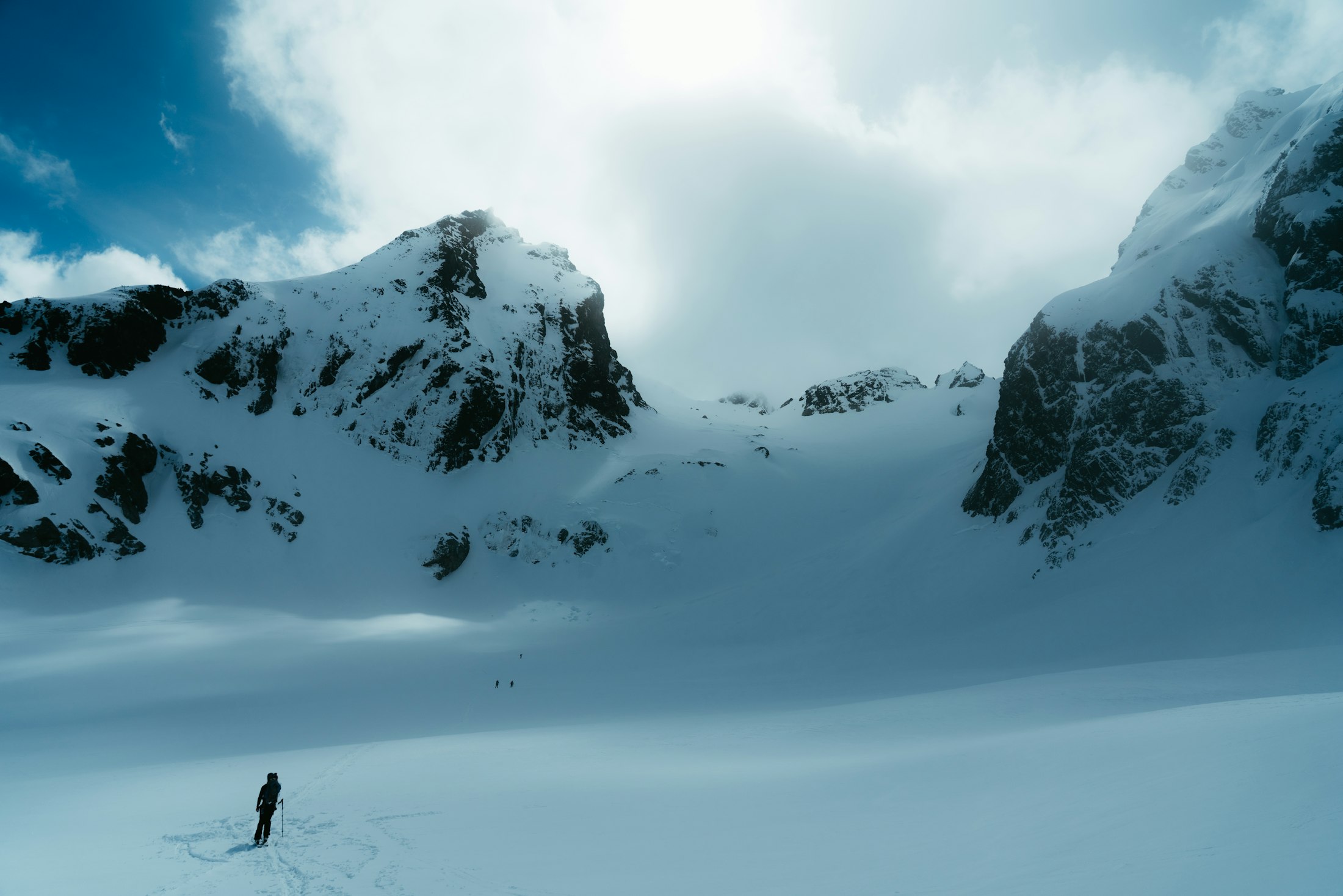 Athlete traversing alpine snow