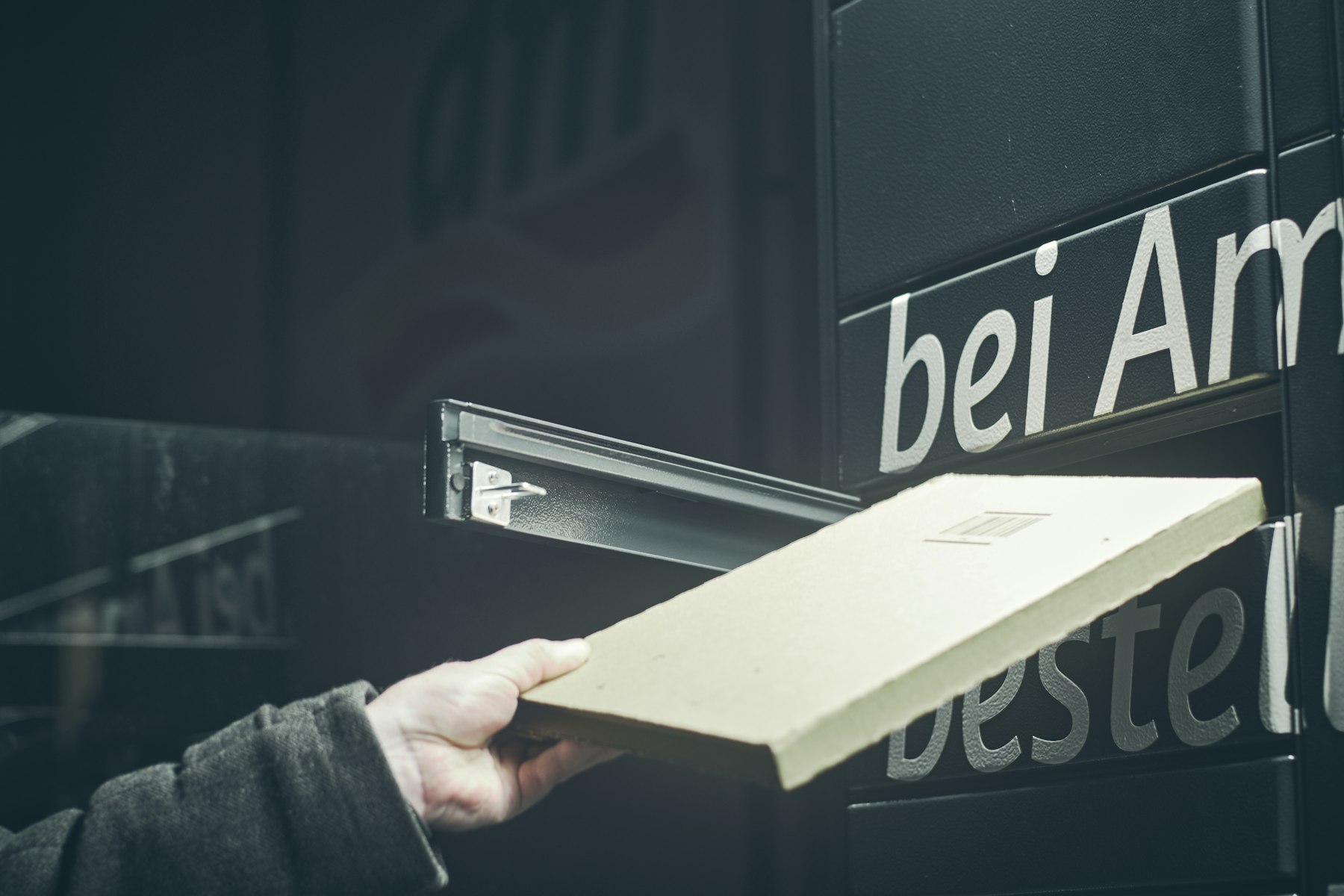 A parcel being dropped off at a parcel locker
