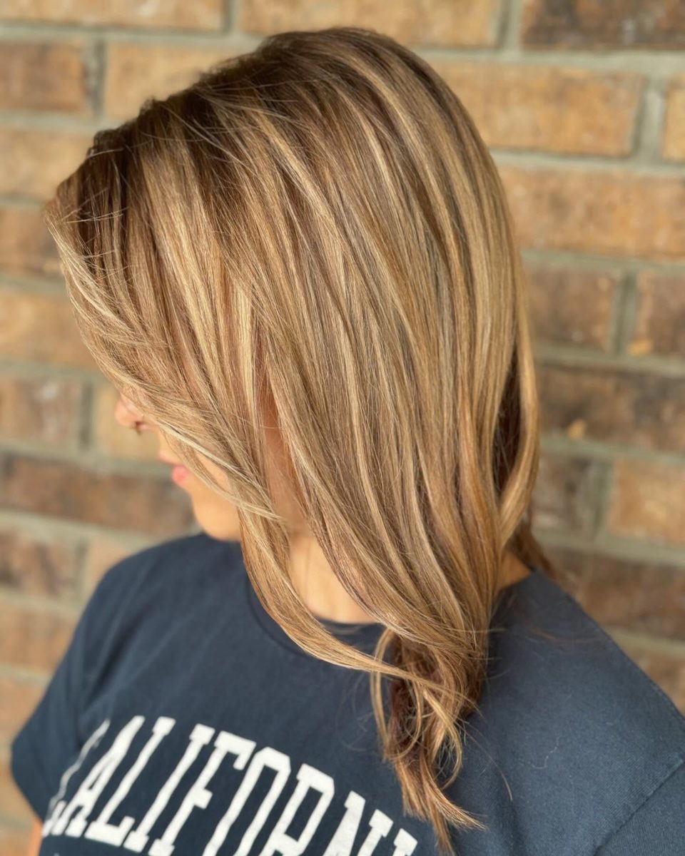 Caramel and honey dimensional highlights on dark hair